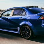 blue porsche 911 on road during daytime