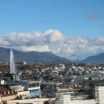 a view of a city with mountains in the background